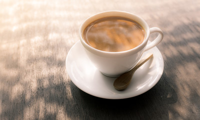 Capuccino, mocha, latte,americano, espresso hot coffee aroma in cup breakfast morning drink on wooden table vintage bar windows in cafe shop with newspaper restaurant background,copy space the left.