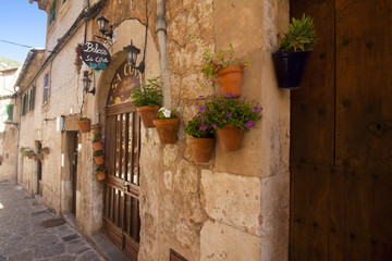Fototapeta na wymiar Beautiful street in Valldemossa, famous old mediterranean village of Majorca Spain.