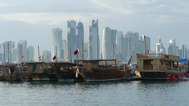 Traditional Dhow, Arab sailing vessels in the Dhow Harbour with the Doha skyline in the background