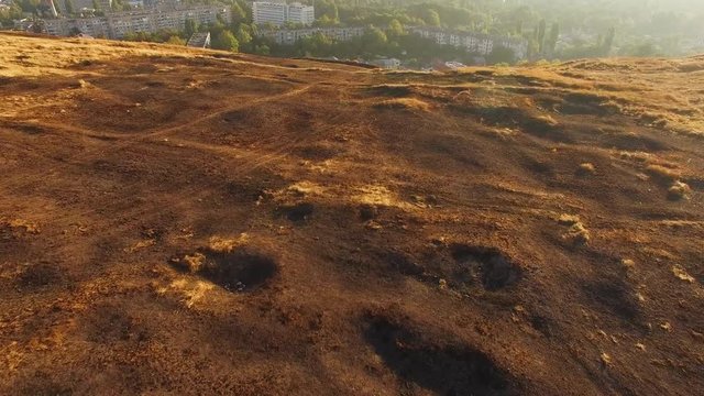AERIAL VIEW. Burnt Grass Damaged By Fire At Scythian Naples, Crimea