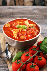 Tomato soup with meatballs in a bowl. Italian minestrone soup