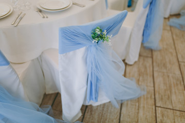Wedding decor for chairs in a restaurant