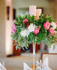 Centerpiece made of peonies and candles