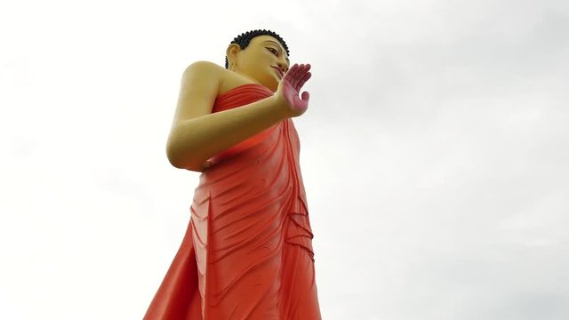 Worlds tallest walking statue of the walking Buddha at Ranawana Temple