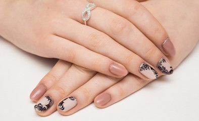 Nail Care And Manicure. Closeup Of Beautiful Female Hands Applying Transparent