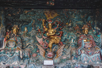 Colorfoul carved in wood buddhist altar in a temple.