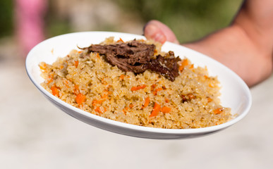 Pilaf in a plate in a cafe