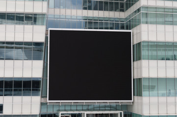 Large blank billboard on a street wall, banners with room to add your own text