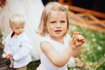 Beautiful little girl with short blonde hair