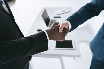 multicultural businessmen handshake