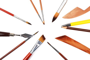 Brushes and painting accessories isolated on white background