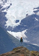 Young women in front of Glaciar Torres - Torres del Paine N.P. (Patagonia, Chile) 