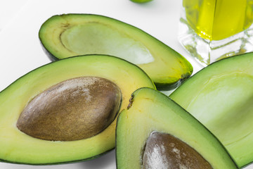 Avocado, fruit like butter, flesh, pip, sliced, lemon, olive oil