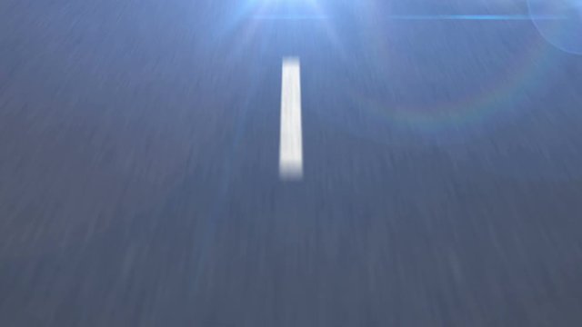 White dotted line on the Asphalt road in motion