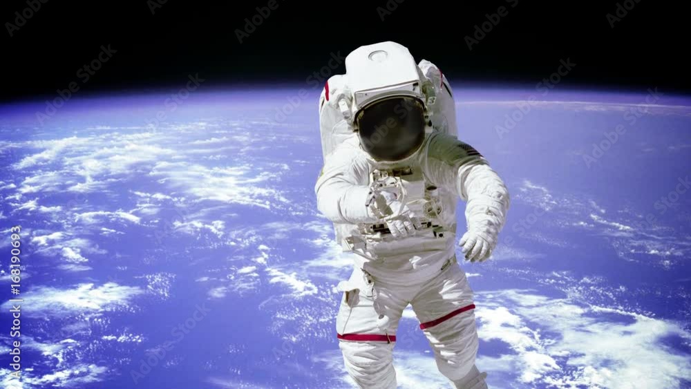 Wall mural the astronaut on a background of a planet. elements of this footage furnished by nasa.