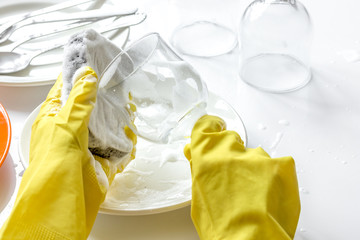 concept of woman washing dishes on white background