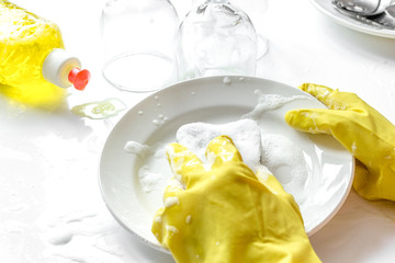 concept of woman washing dishes on white background