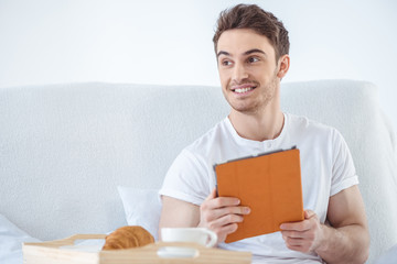 man using digital tablet