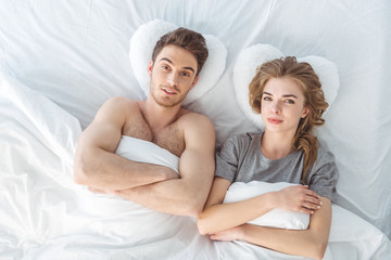 Obraz na płótnie Canvas couple lying in bed