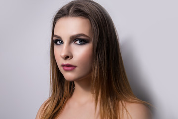 Fototapeta premium Fashionable portrait of a girl model. Fashion, smoky eyes makeup.