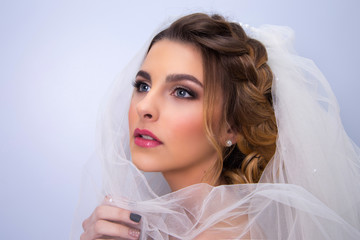 beautiful woman  bride with tiara on head  on bright background , copy space.