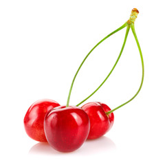 Red cherries on a white isolated background.