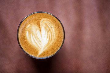 Cup of delicious italian cappuccino on background. 