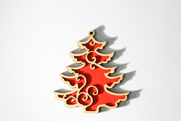 Red wooden christmas christmas tree ornament on white