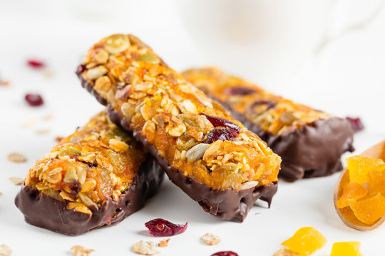 Granola Bars With Dried Fruits And Honey In Chocolate