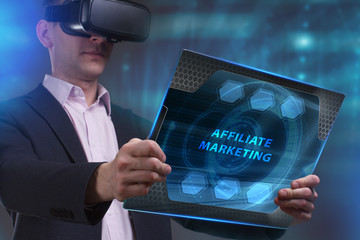 Business, Technology, Internet and network concept. Young businessman working on a virtual screen of the future and sees the inscription: Affiliate marketing