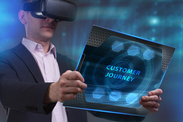 Business, Technology, Internet and network concept. Young businessman working on a virtual screen of the future and sees the inscription: Customer journey