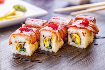 Freshly prepared sushi on a wooden table. Sushi menu