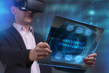 Business, Technology, Internet and network concept. Young businessman working on a virtual screen of the future and sees the inscription: Document management