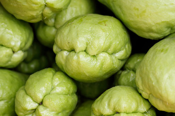 Close up chayote (Sechium edule) fruit background look like a group of monster head 