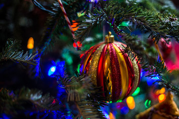 Christmas time setup with Christmas tree with ornaments, lights, and presents