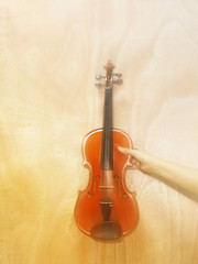 Naklejka na ściany i meble closeup the body of violin ,on wooden background,in glamour glow tone,lens flare render design,vintage style,blurry light around.