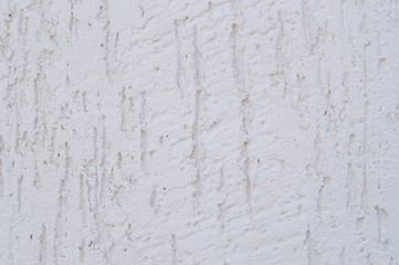 White shabby plaster on the wall as a background, texture