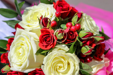 gold rings on roses (wedding bouquet)