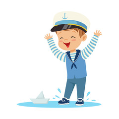 Cute smiling little boy character wearing a sailors costume standing in a puddle playing with paper boat colorful vector Illustration