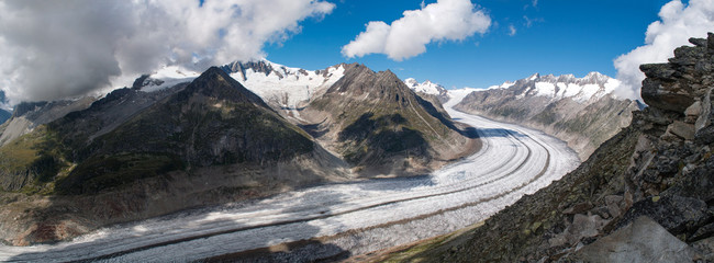 Aletschgletscher glacier in the Switzerland. Snowy high mountains and glacier in the valley.