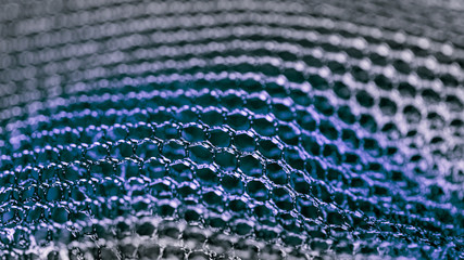 Blue abstract texture from mesh. Artistic detail of hexagonal grid in HD 16x9 ratio. Concept for...
