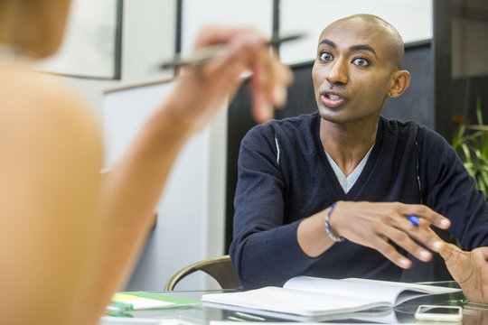 Serious people talking in meeting
