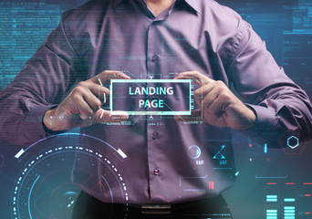 Business, Technology, Internet and network concept. Young businessman working on a virtual screen of the future and sees the inscription: Landing page