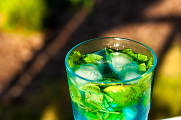 Tradition Summer drink blue mojito with lime mint and ice