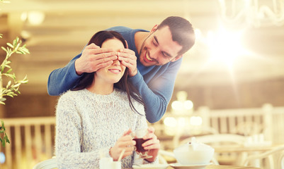happy couple drinking tea at cafe