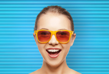 Fototapeta premium happy teenage girl or woman face in shades