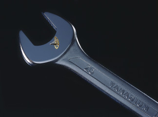 A vanadium steel wrench with a clock gear.