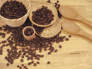 coffee bean in little basket and spoon wood on slat wood