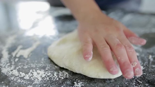 Woman preparing dough basis.Ingredients for baking.Making dough by female hands.Cooking and baking concept