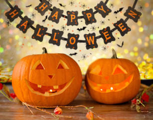 carved pumpkins and happy halloween garland